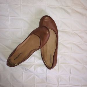 Light brown flats.
